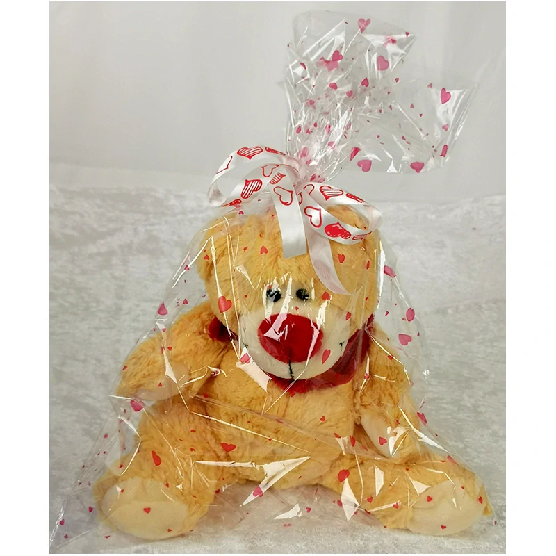 Medveď plyšový v darčekovom vrecku a stuhou so srdiečkami