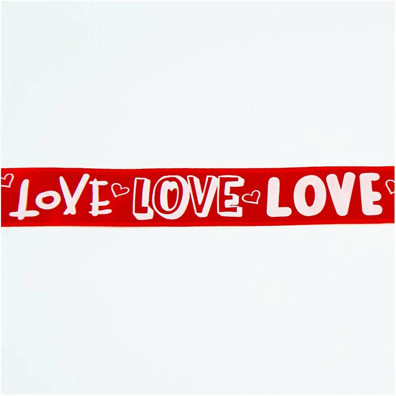 Stuha 23,7 m x 2,5 cm - červená s bielymi nápisom Love