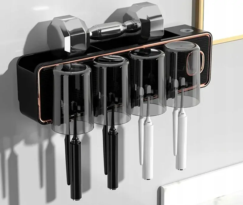 Držiak na zubné kefky s dávkovačom pasty a pohárikmi