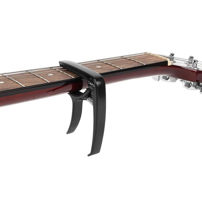 Kapodaster na gitary + 3 trsátka