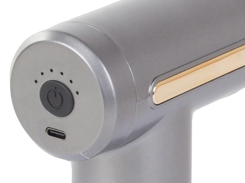 Pištoľ na masírovanie tela sivá s 4 nástavcami a 6 úrovňami intenzity