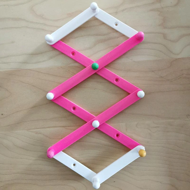 Skladací nástenný vešiak harmonika 18 cm bielo-zelený, rozsah 10 – 45 cm, 10 háčikov